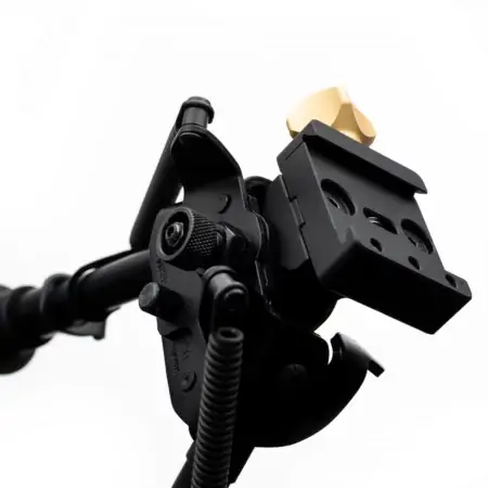 An angled view of the front of a Harris Bipod ARCALOCK Clamp mounted to a Harris Bipod