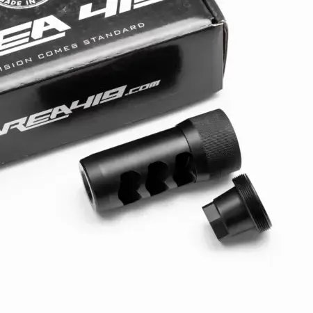 A Hellfire muzzle brake with universal adapter and packaging in black