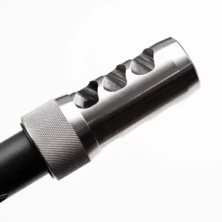A stainless hellfire brake mounted on a barrel