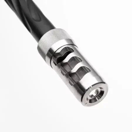 A stainless hellfire brake on a barrel pointed downwards.