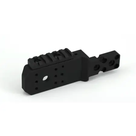 A Spigot mount on it's side showing a mounted piece of pic rail