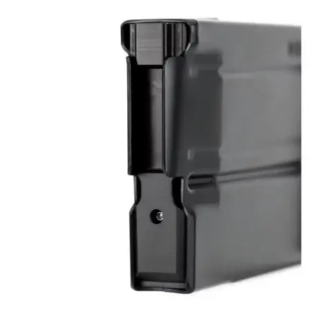 A view of the feed lips on a 6MM ARC AICS Metal Magazine. The magazine is resting on its front.