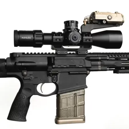 A tactical one-piece scope mount on an AR-15, with a Kahles scope and weapon mounted laser range finder